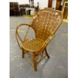 A WOVEN SPLIT WALNUT AND RUSTIC BENTWOOD ELBOW CHAIR, THE HOOP BACK AND CIRCULAR SEAT OF WOVEN