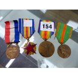 A GROUP OF FOUR FRENCH MILITARY MEDALS.