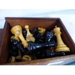 A STAUNTON PATTERN CHESS SET IN A WOODED BOX.