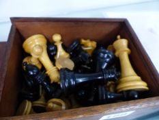 A STAUNTON PATTERN CHESS SET IN A WOODED BOX.