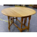 AN OAK COTTAGE GATE LEG SUPPER TABLE THE TOP 134 X 113 X 74 TOGETHER WITH FOUR SIMILAR RUSH SEAT