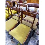 THREE GEORGIAN DINING CHAIRS AND A VICTORIAN LARGE ARM CHAIR.