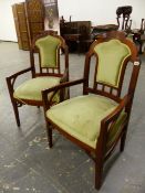 A PAIR OF INTERESTING ARTS MOVEMENT UPHOLSTERED ARM CHAIRS.