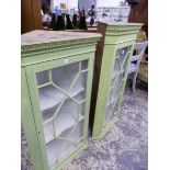 TWO SIMILAR PAINTED ASTRAGAL GLAZED CORNER CABINETS.