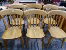 A SET OF SIX PINE SPINDLE BACK KITCHEN CHAIRS.