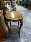 A SMALL FRENCH GOLD DECORATED TWO TIER TABLE.