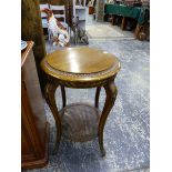 A SMALL FRENCH GOLD DECORATED TWO TIER TABLE.