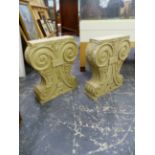 A PAIR OF COMPOSITION CLASSICAL STYLE CONSUL TABLE SUPPORTS. H 75 X MAX WIDTH 64cms.