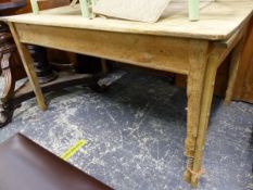 A RUSTIC PINE FARMHOUSE KITCHEN TABLE.