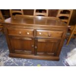 AN ERCOL MID ELM SIDE CABINET. W 96 X D 49 X H 71cms.