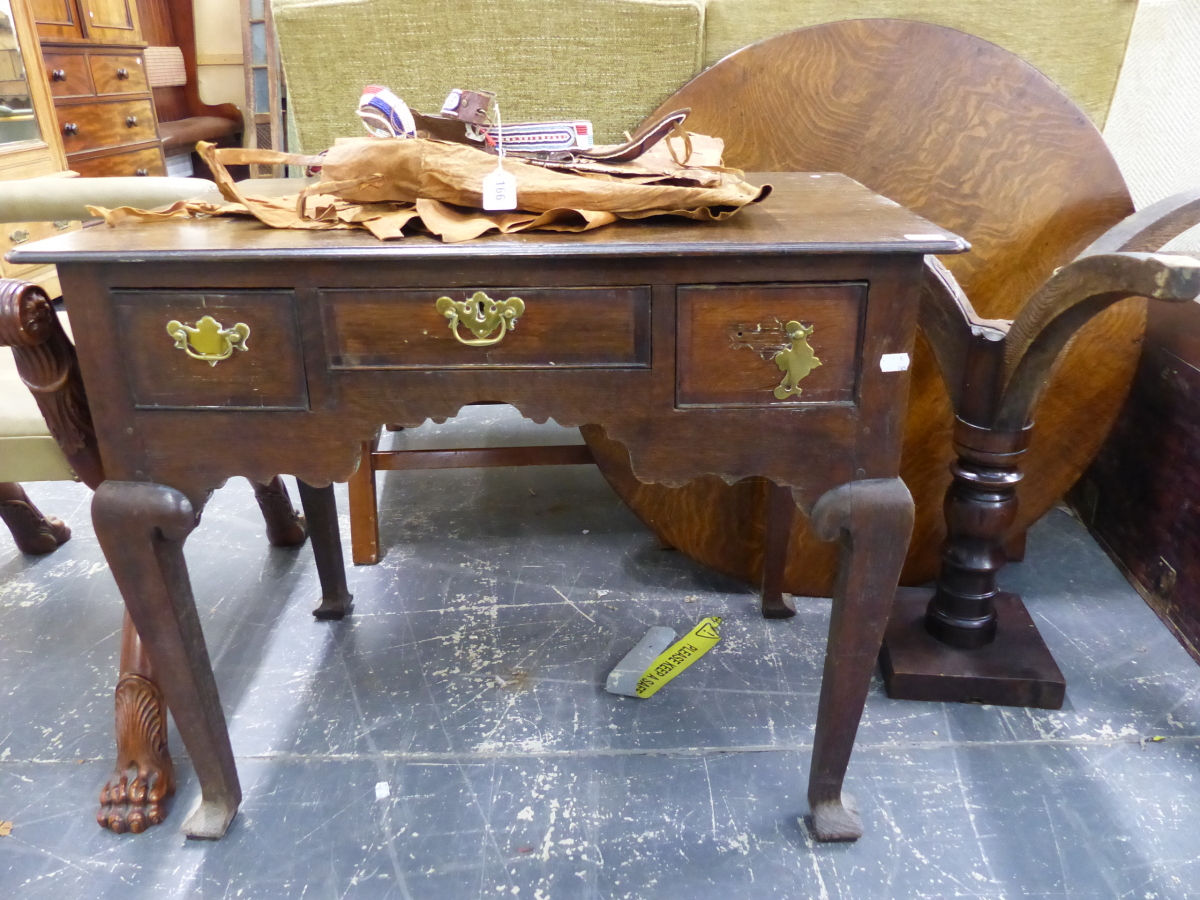 A LATE GEORGIAN COUNTRY OAK LOW BOY ON SHAPED SQUARE SECTION LEGS, TOGETHER WITH AN OAK TRIPOD