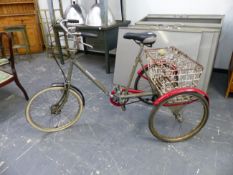 A PASHLEY PICADOR TRICYCLE WITH BACK SHOPPING BASKET.