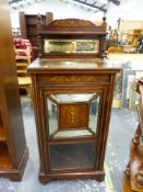 AN EDWARDIAN INLAID ROSEWOOD MUSIC CABINET WITH MIRROR BACK AND DOOR.