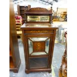 AN EDWARDIAN INLAID ROSEWOOD MUSIC CABINET WITH MIRROR BACK AND DOOR.