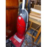 A MIELE POWER PLUS VACUUM CLEANER.
