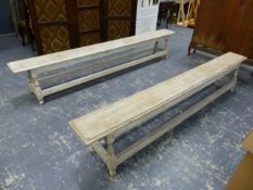 A NEAR PAIR OF ANTIQUE LIMED OAK FORMS / BENCHES ON SPLAY TURNED LEGS WITH PERIPHERY STRETCHER. L
