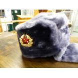 A RUSSIAN FAUX FUR MILITARY TYPE HAT.