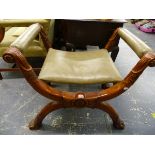 A LEATHER UPHOLSTERED CLASSICAL STYLE X FRAME STOOL.