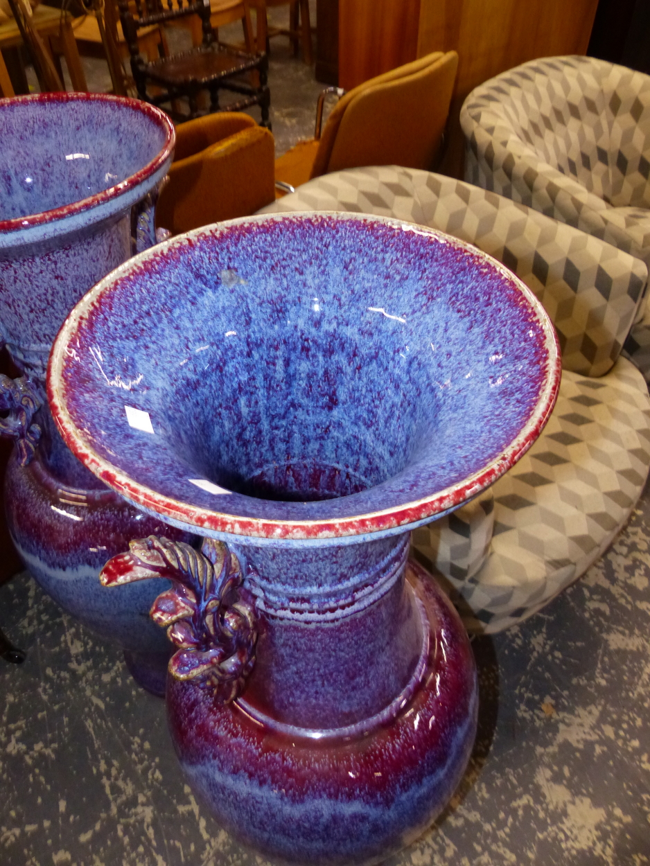 A PAIR OF LARGE ORIENTAL LARVA GLAZED FLOOR URNS, TOGETHER WITH AN ART DECO STYLE LARGE URN. THE - Image 2 of 10