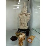 AN ORIENTAL BLANC DE CHINE SEATED GODDESS FIGURINE TOGETHER WITH TWO CARVED WOOD AND THREE CAST