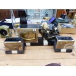 AN ART DECO STYLE CLOCK GARNITURE WITH SPELTER FIGURINE OF A RECLINING LADY.