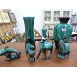 A GROUP OF GREEN LAVA GLAZED VASES AND FIGURINES. BLUE MOUNTAIN POTTERY, MADE IN CANADA.