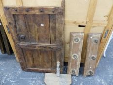 A HEAVY RUSTIC WOOD SMALL DOOR, AND TWO RE- PURPOSED COAT HOOKS.