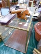 A LARGE BRASS BOUND TABLE TOP MODEL DISPLAY CASE, MODEL CANNON, WINE ACCOUTREMENTS ETC.