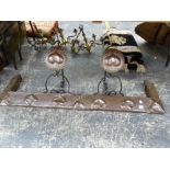 AN ART NOUVEAU COPPER FIRE CURB AND A PAIR OF COPPER AND WROUGHT IRON MATCHING DOGS.