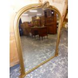 A LARGE VICTORIAN STYE GILT FRAMED ARCH TOP OVER MANTLE MIRROR. W 120 X H 140cms.
