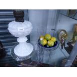 AN ANTIQUE OPAQUE GLASS OIL LAMP, PAIR OF GLASS DISHES AND POTTERY LEMONS.