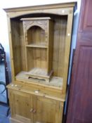 A MODERN PINE BOOKCASE CABINET AND A SMALL PINE SHELF UNIT. BOOKCASE W 95 X D 43 X H 188CMS.