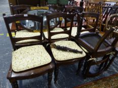 A SET OF SEVEN LATE VICTORIAN OAK DINING CHAIRS WITH SOLID SEATS.