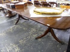 A GEORGE III STYLE MAHOGANY TWIN PEDESTAL DINING TABLE INCLUDING TWO EXTENSION LEAVES. L 270 X W