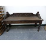 A CARVED OAK HALL BENCH. W 122 X D 37 X SEAT HEIGHT 45CMS.