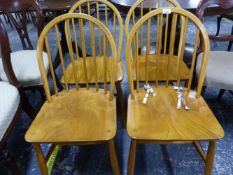 A SET OF FOUR ERCOL TYPE ELM SEAT HOOP BACK CHAIRS.