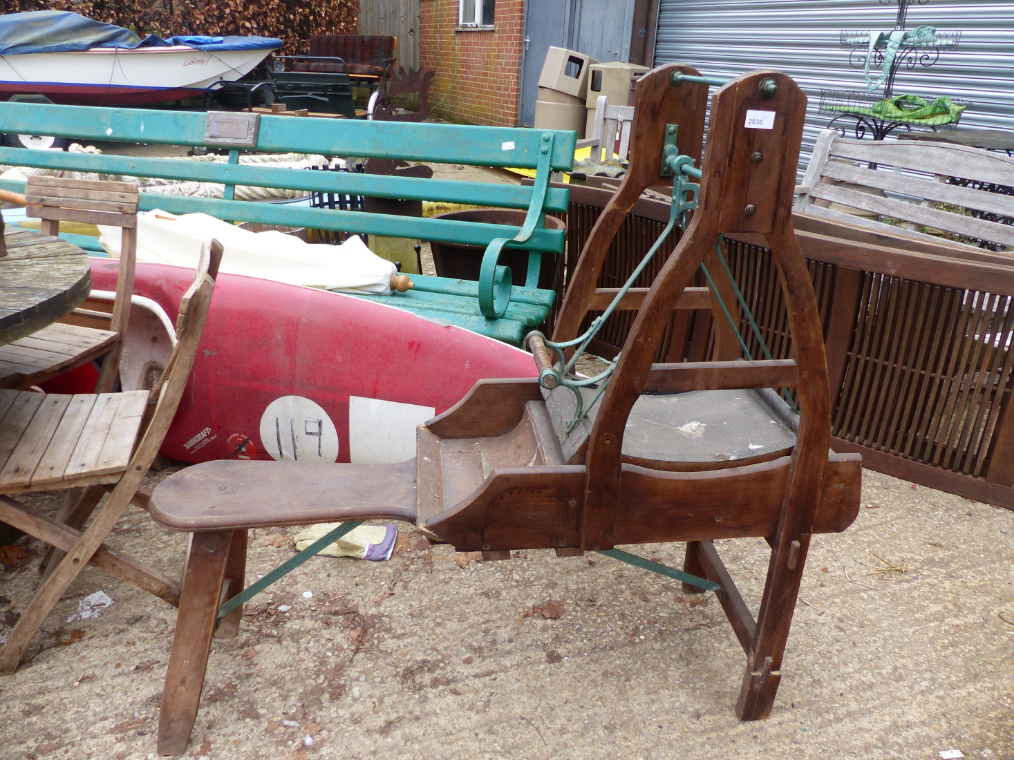 A VINTAGE CARDING CRADLE.