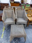 A RATTAN SET OF FOUR CONSERVATORY ARMCHAIRS, TOGETHER WITH A SIMILAR RATTAN LOW TABLE.