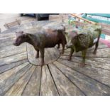 TWO CAST IRON COW FIGURES.