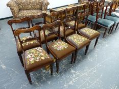 A SET OF EIGHT WILLIAM IV ROSEWOOD DINING CHAIRS WITH CARVED BACK RAILS, DROP IN SQUAB SEATS, AND