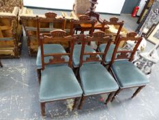 A SET OF SIX LATE VICTORIAN CARVED BACK DINING CHAIRS.