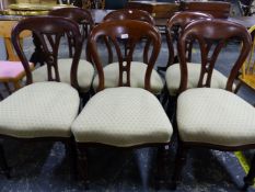 A SET OF SIX VICTORIAN MAHOGANY BALLOON BACK DINING CHAIRS.