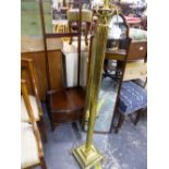 A MAHOGANY CHEVAL MIRROR, TOGETHER WITH A BRASS STANDARD LAMP.