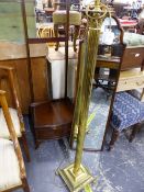 A MAHOGANY CHEVAL MIRROR, TOGETHER WITH A BRASS STANDARD LAMP.