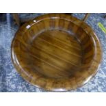 A LARGE ORIENTAL CARVED WOOD WASHBOWL. DIAMETER 78CMS.