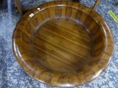 A LARGE ORIENTAL CARVED WOOD WASHBOWL. DIAMETER 78CMS.