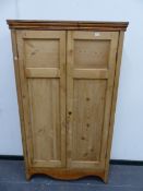 A VICTORIAN PINE TWO DOOR SHELVED CUPBOARD. W 102 X D 34 X H 174CMS.