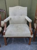 A LARGE GEORGIAN STYLE GAINSBOROUGH ARM CHAIR. WIDTH AT FRONT 70CMS SEAT HEIGHT 43CMS.