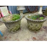 A PAIR OF LATTICE DECORATED GARDEN URNS / PLANTERS.