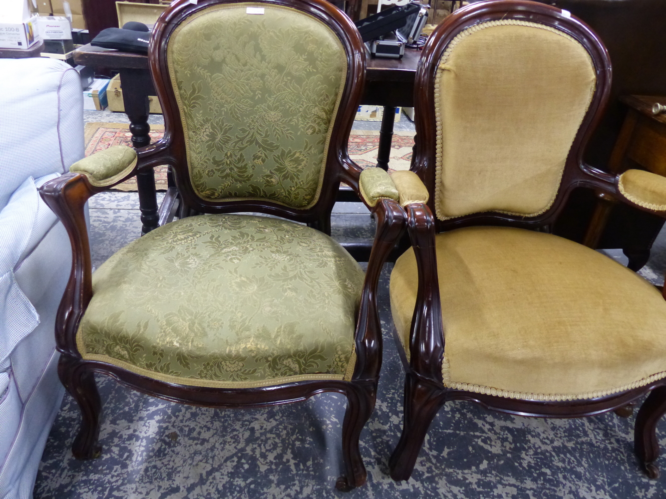 A PAIR OF CARVED SHOW FRAME SALON ARMCHAIRS.